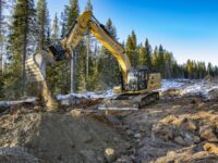 Cat-Bagger mit Tiltrotator und Frontschild